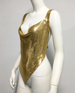 Close-up of golden metallic sequin mesh fabric on cowl neck party top for women