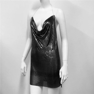 Close-up of black metallic chainmail mini dress with deep V-neck and thin chain straps
