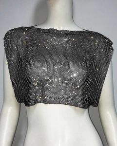 Detail of silver-black sequin mesh top featuring sparkling rhinestones and metal chain