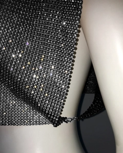 Detail of black metallic mesh top with sparkling rhinestones and lobster clasp closure