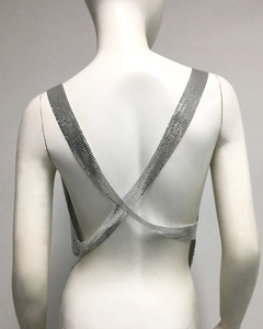 Detailed back view of silver metal mesh top with criss-cross backless straps design
