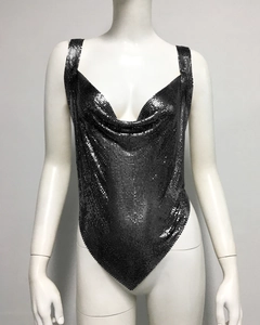 Detail of black metal mesh crop top showing shimmery sequins and deep v-neckline