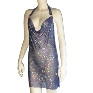 Macro detail of sparkly rhinestone mesh fabric on silver halter neck party dress