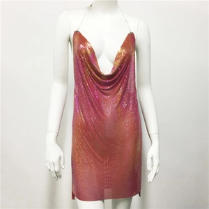 Macro detail of pink sequins and metallic mesh texture on a party slip dress