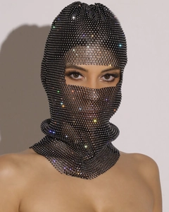 Close-up of black mesh face mask with sparkling rhinestones and elastic eye openings
