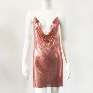 Detail of rose gold metallic mesh mini dress featuring a cowl neck and sequin texture