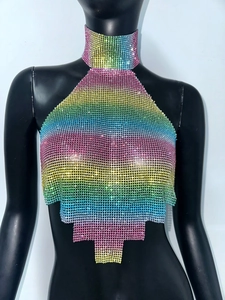 Detailed view of rainbow rhinestone halter top with sparkling metal mesh and tiered hemline