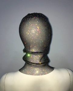Detail view of colorful rhinestones on a black mesh full head mask and face cover