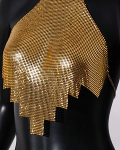 Close-up of golden chainmail halter top with metallic sequins and asymmetrical hem