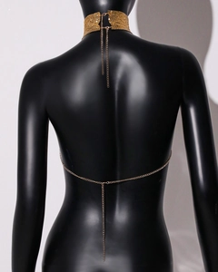 Detail of gold metal mesh collar with adjustable extension chain and V-shaped back chain