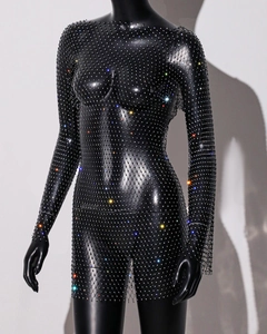 Close-up of black mesh dress with high-density colorful rhinestone embellishments