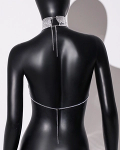 Detailed back view of silver sequin mesh body chain and choker set on a black mannequin