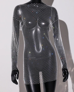 Close-up of sparkling rhinestones on long sleeve mesh mini dress with镂空 structure