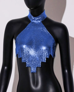 Detailed view of bright blue metal sequin halter top with glossy mesh texture on mannequin