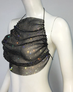 Close-up of black fishnet halter top with shimmering rhinestones and tie-up neck detail