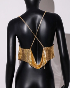 Detail of gold metal mesh top featuring a crisscross back and delicate chain straps