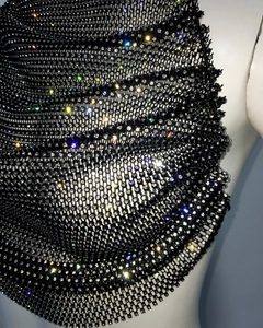 Macro view of black fishnet camisole top featuring shimmering white rhinestones