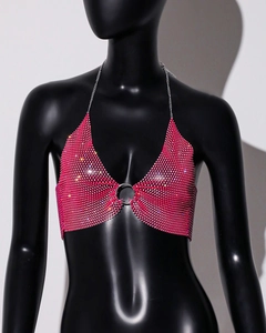 Detail of rose pink rhinestone mesh crop top featuring a silver center ring and chains