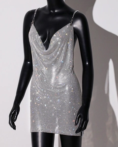 Detail of metal chain strap and rhinestone mesh fabric on silver party dress