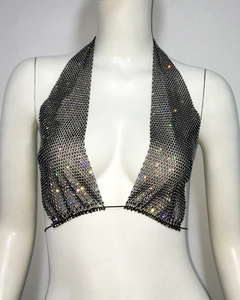 Close-up of black mesh halter top featuring shimmering multicolored rhinestones