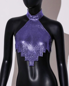 Detail of purple sequin halter top featuring metallic mesh texture and jagged hemline
