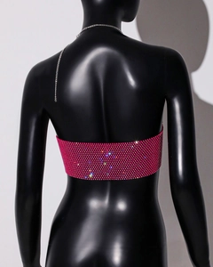 Close-up of pink rhinestone mesh camisole with silver chain straps and shimmering crystals
