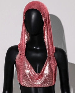 Detail of pink metal sequin halter top featuring a hooded design and sparkly mesh texture
