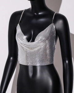 Detail of silver metallic mesh crop top with rhinestone straps and draped neckline
