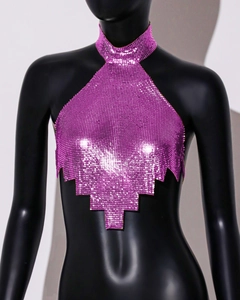 Detail of purple metallic sequin halter top featuring a unique geometric tiered hemline