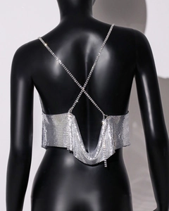 Detailed back view of silver sequin crop top with sparkling rhinestone crisscross straps