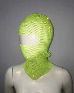 Detail of neon green rhinestone mesh balaclava mask showing sparkling crystal texture