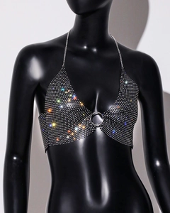 Detail of silver rhinestone halter top showing the metal O-ring and mesh texture