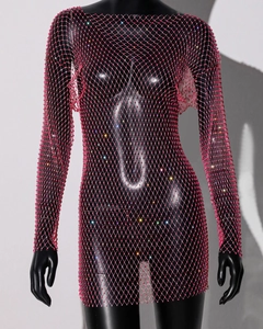 Close-up of pink fishnet dress with sparkling rhinestones and long sleeves texture