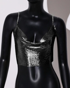 Detailed view of black metal sequin halter top with fine mesh texture on a mannequin