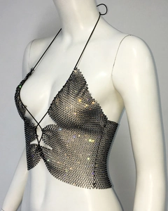 Macro view of rhinestone fishnet halter top with crystal chain mesh and black cord straps