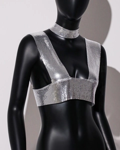 Detail of silver metallic mesh halter top and choker on a minimalist female mannequin