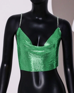 Close-up of green sequin crop top with sparkling rhinestone straps for party wear