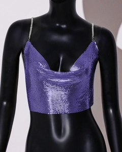 Detailed view of purple metallic sequin mesh fabric with sparkly rhinestone chain straps