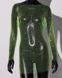 Detailed close-up of fluorescent green mesh fabric with sparkling rhinestones and sequins