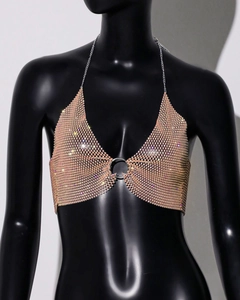 Macro detail of champagne rhinestone mesh top with silver metal ring and chain neck strap