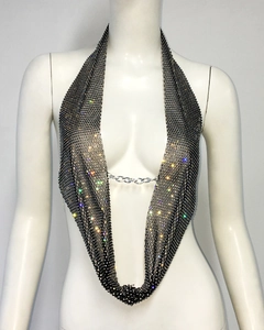Macro shot of black mesh halter top featuring colorful rhinestones and silver chain detail