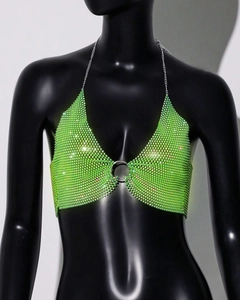 Detail of neon green rhinestone mesh bralette with silver ring and halter metal chain