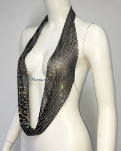 Detailed view of colorful rhinestones on black metal mesh halter top for parties