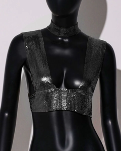 Detailed view of gunmetal sequins and chain links on a sexy metallic halter crop top