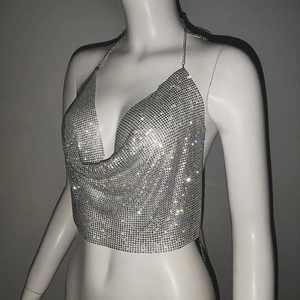 Close-up of shiny silver sequin halter top with deep cowl neck for party wear