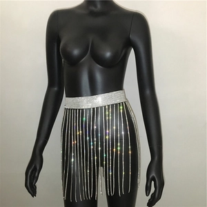 Detailed view of shimmering silver sequin fringe waist chain with rhinestone tassels