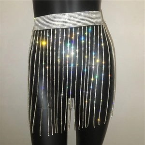 Close-up of sparkling silver rhinestone tassel body chain and waist belt on a mannequin