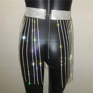 Close-up of sparkling silver rhinestone waist chain with layered fringe tassels