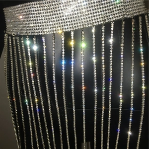 Macro shot of silver tassel waist chain with shimmering rhinestones and metallic finish