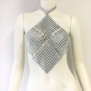 Detail of a sparkling rhinestone halter body chain featuring a mesh diamond pattern